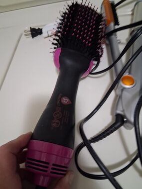 Pink and Black Hot Air Hair Brush Dryer And Various Styling Items